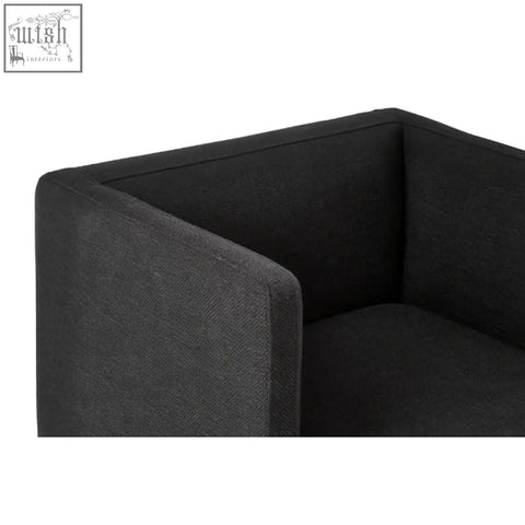 Black dining chair with black upholstered seat and silver legs featuring a modern minimalist design