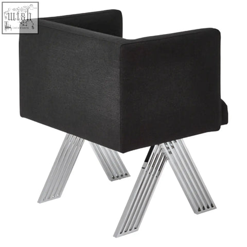 Black dining chair with black upholstery and modern angular design featuring silver legs for dining use