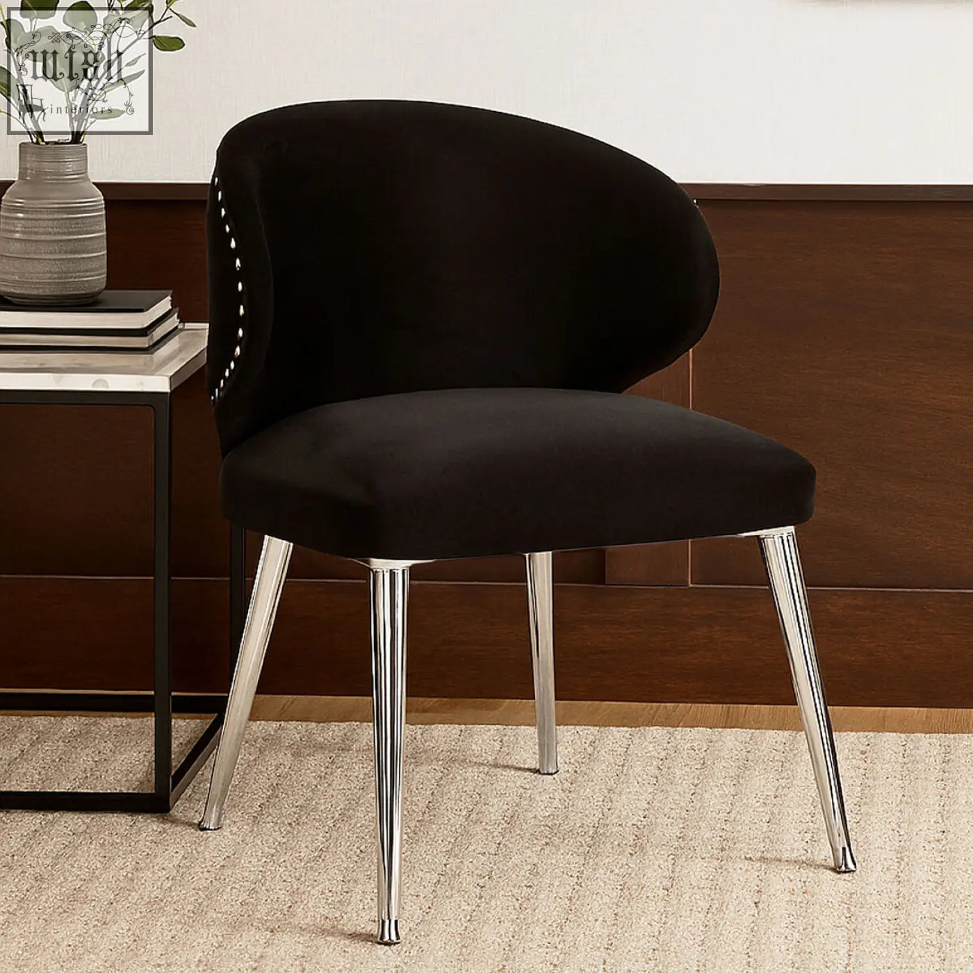 Black velvet piermount dining chair with chrome legs and nailhead trim perfect for stylish dining spaces