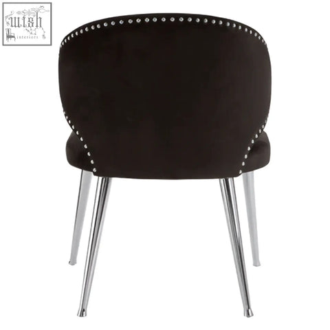 Black velvet piermount dining chair with chrome legs and decorative nailhead trim perfect for dining room use