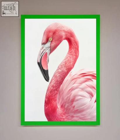 A vibrant pink flamingo stare framed print with a bold green frame perfect for lively wall decor
