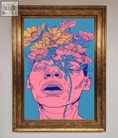 A gold-framed pop-art canvas wall art with a pink-skinned face, blue tears, and yellow pink flowers on teal background