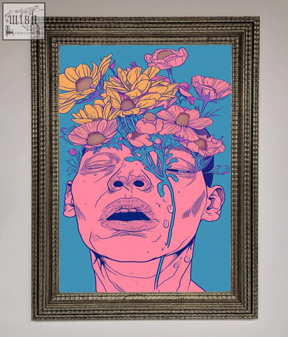 A vibrant pop-art pink flowers on face framed wall art with a pink-skinned face and silver textured frame on blue background