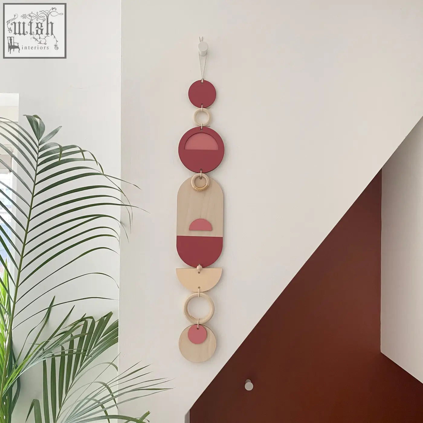 A modern wall art with layered terracotta, beige, and cream geometric shapes perfect for minimal home decor
