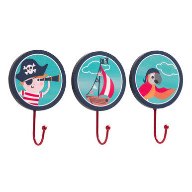 Set of three pirate wall hooks with red metal hooks navy blue rims and cartoon designs on teal background