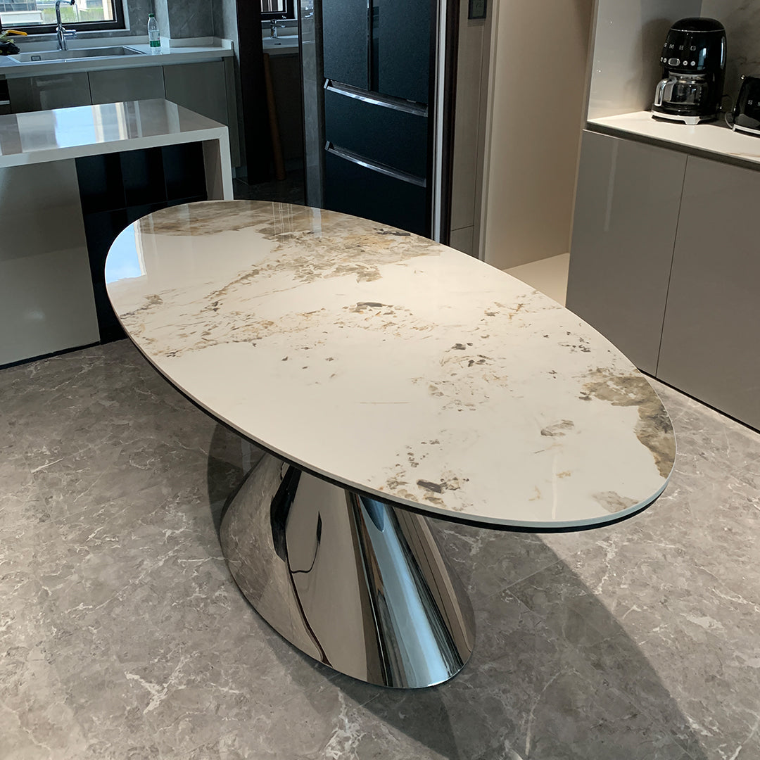 Elegant pires oval dining table with white sintered stone top and polished chrome pedestal base
