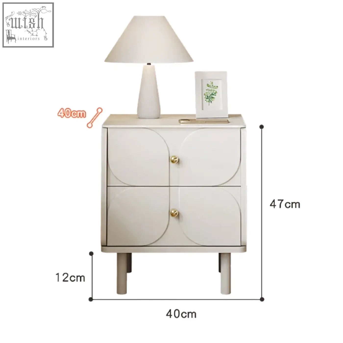 Cream-colored placebo bedside table with two curved drawers and gold-toned knobs for stylish bedside storage