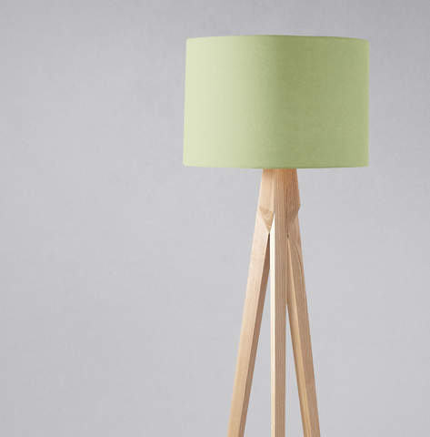 Minimalist tripod floor lamp with sage green fabric lampshade and light wood legs for table lamp or ceiling use