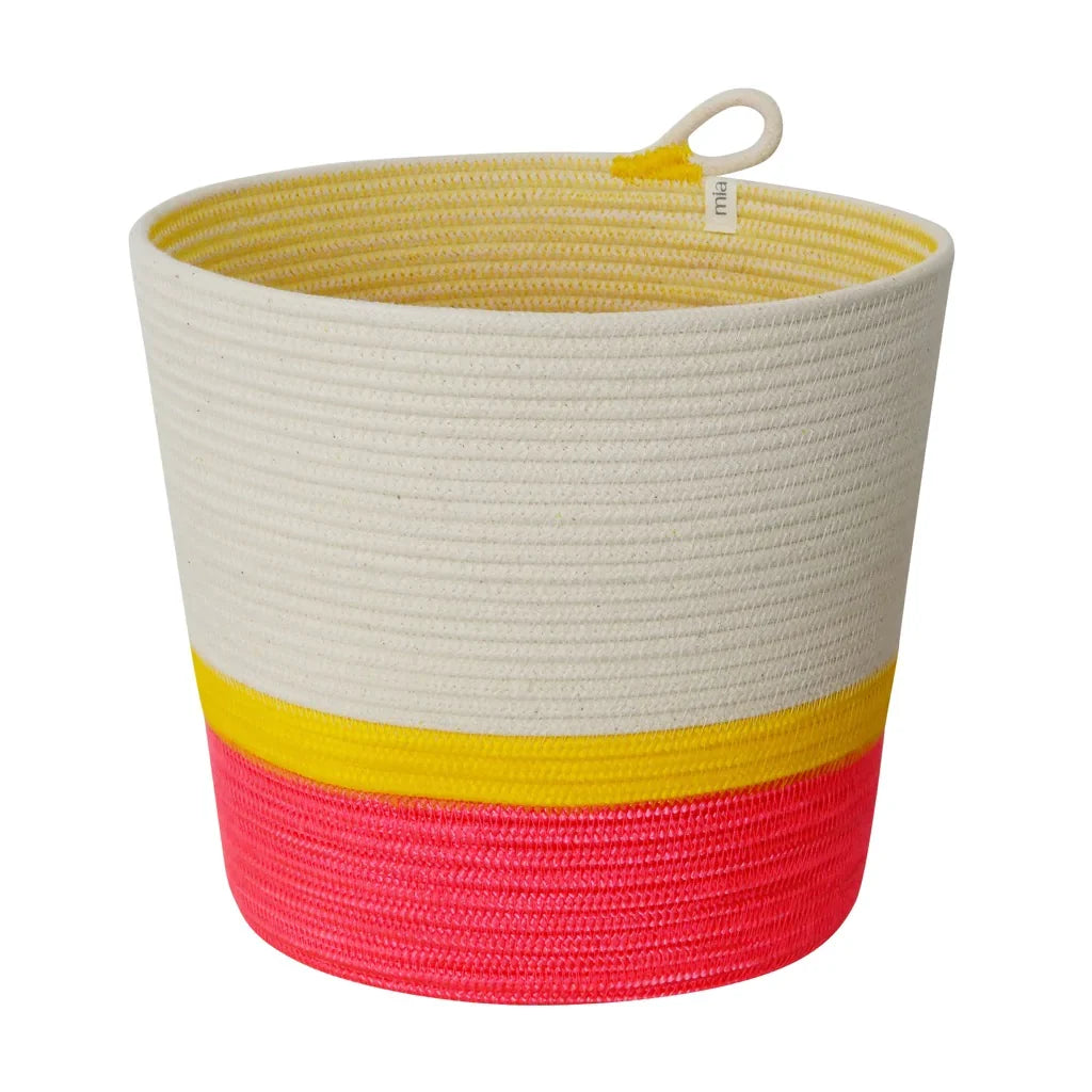 A cylindrical woven planter basket made of 100 percent cotton rope in white yellow and pink color blocks