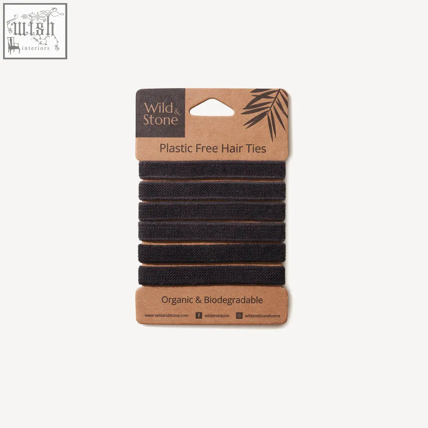 Black fabric hair ties made from organic cotton packaged plastic free by wild and stone in a brown cardboard display card