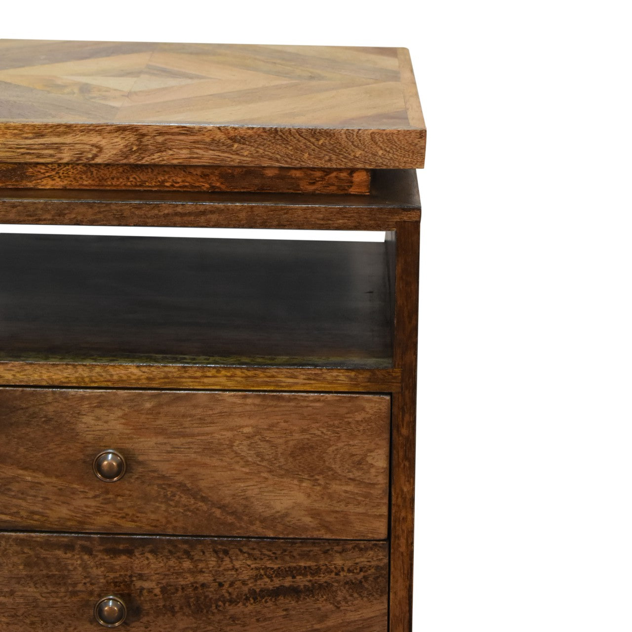 A rustic wooden platform bedside table with a herringbone top and two drawers with brass knobs