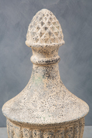 Weathered stone effect urn with textured speckled surface and conical top featuring diamond-shaped indentations plato light stone