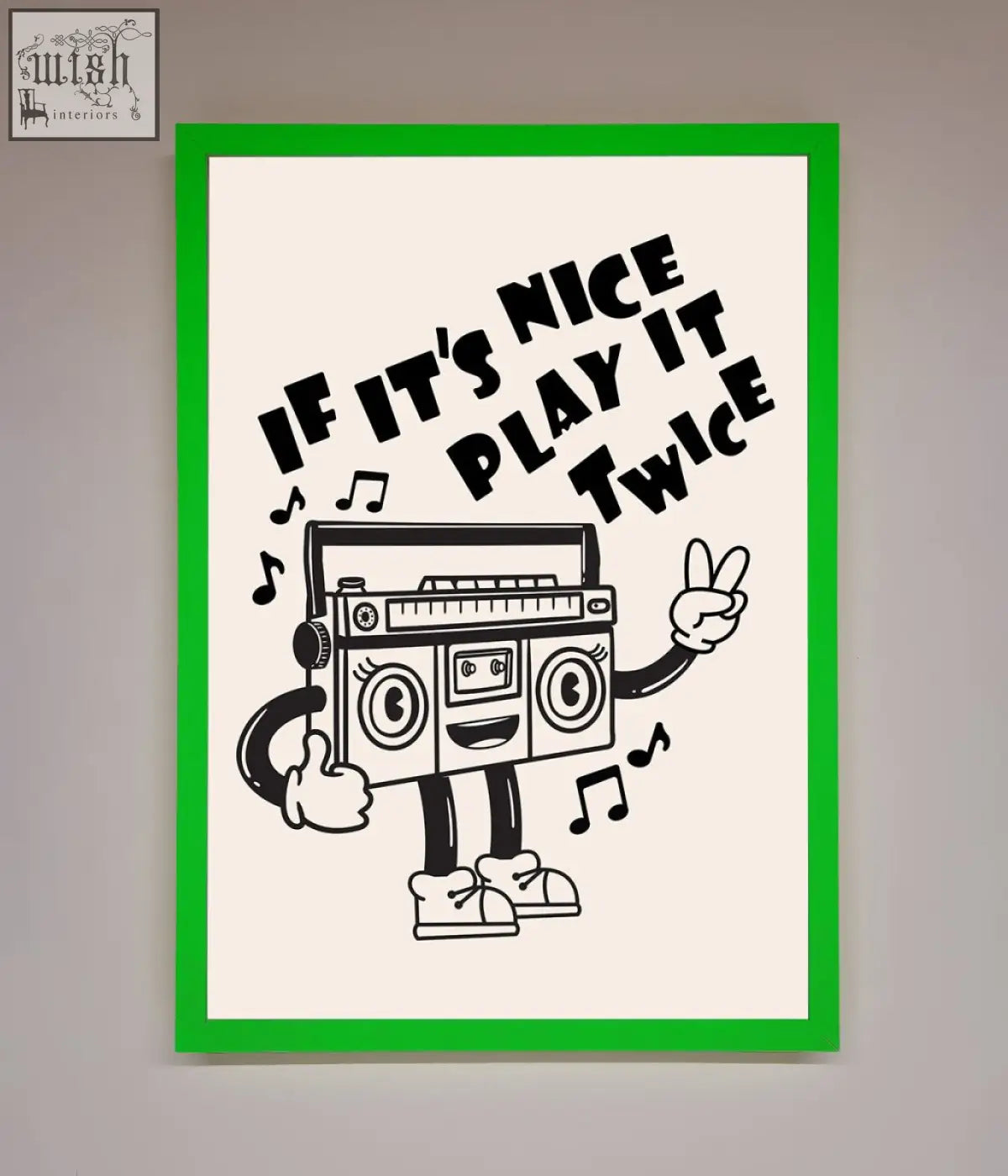 Play twice framed wall art featuring a cartoon boombox with headphones in a green frame on cream background wall art