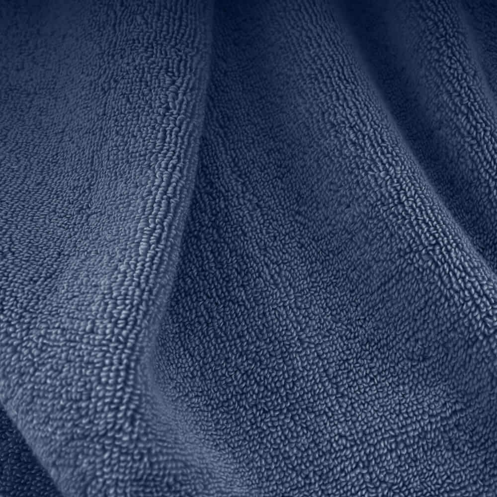 Deep blue plush towels made of soft textured terry cloth perfect for cozy drying needs