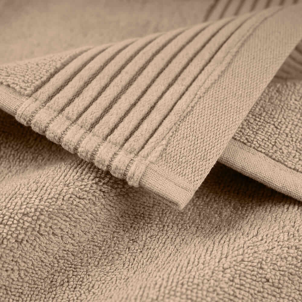 Beige plush towels set with ribbed edge and soft absorbent weave perfect for everyday use