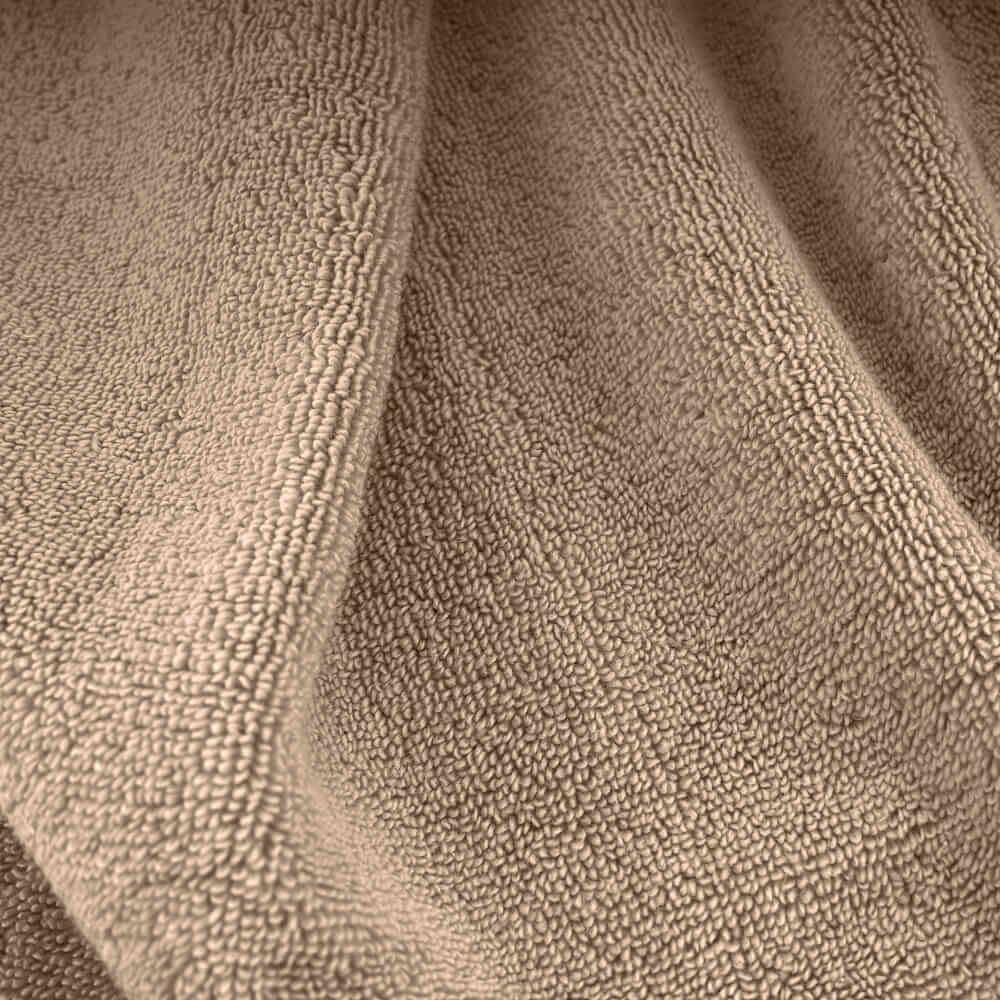 Beige plush towels set made of soft textured terry cloth perfect for cozy bath time comfort