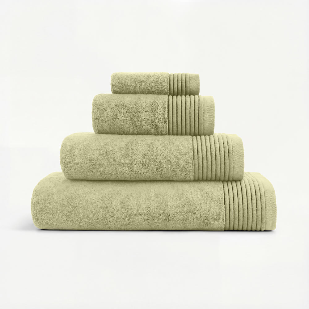 Set of four olive green plush towels made from soft cotton with ribbed edges in a plush towels set