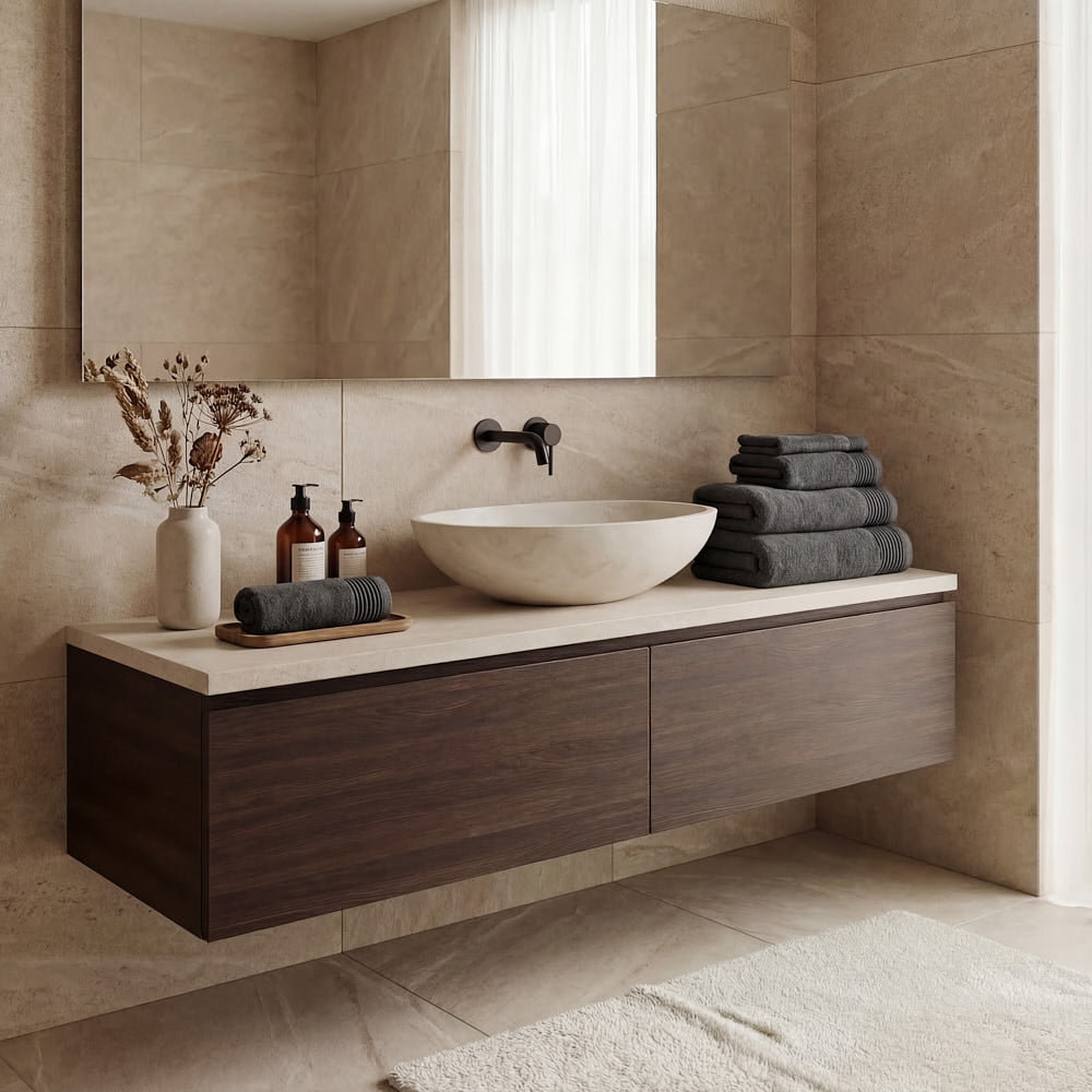 A sleek white stone vessel sink on a dark wood vanity paired with a plush towels set for a cozy bathroom look