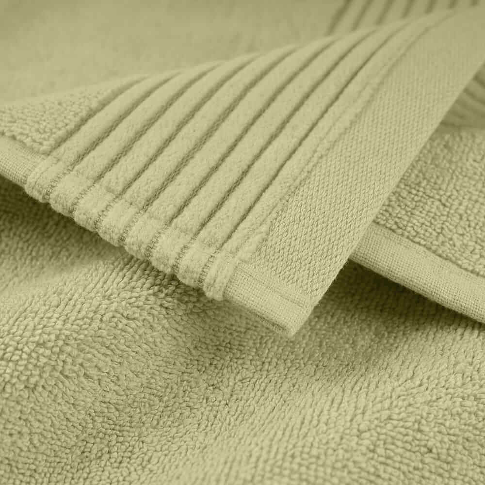 Soft pale green plush towels with ribbed edge and plush terry cloth texture perfect for cozy use