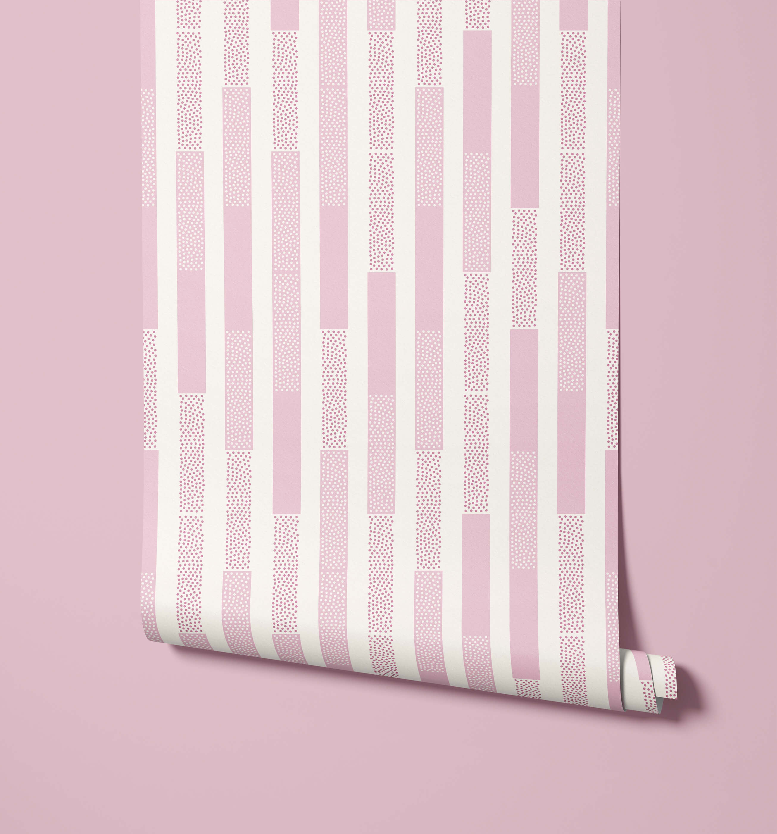 A roll of polka wallpaper with pink and white stripes and a dotted texture pattern for wall decor