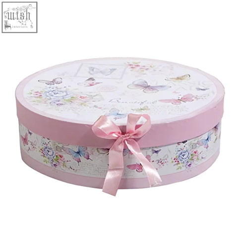 A round pastel pink gift box with butterfly floral pattern and satin bow for porcelain pasta soup bowls set