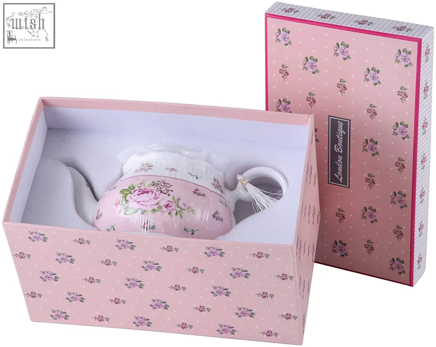 Pink floral ceramic teapot with white handle and spout in matching pink polka-dot gift box with sugar bowl and milk jug