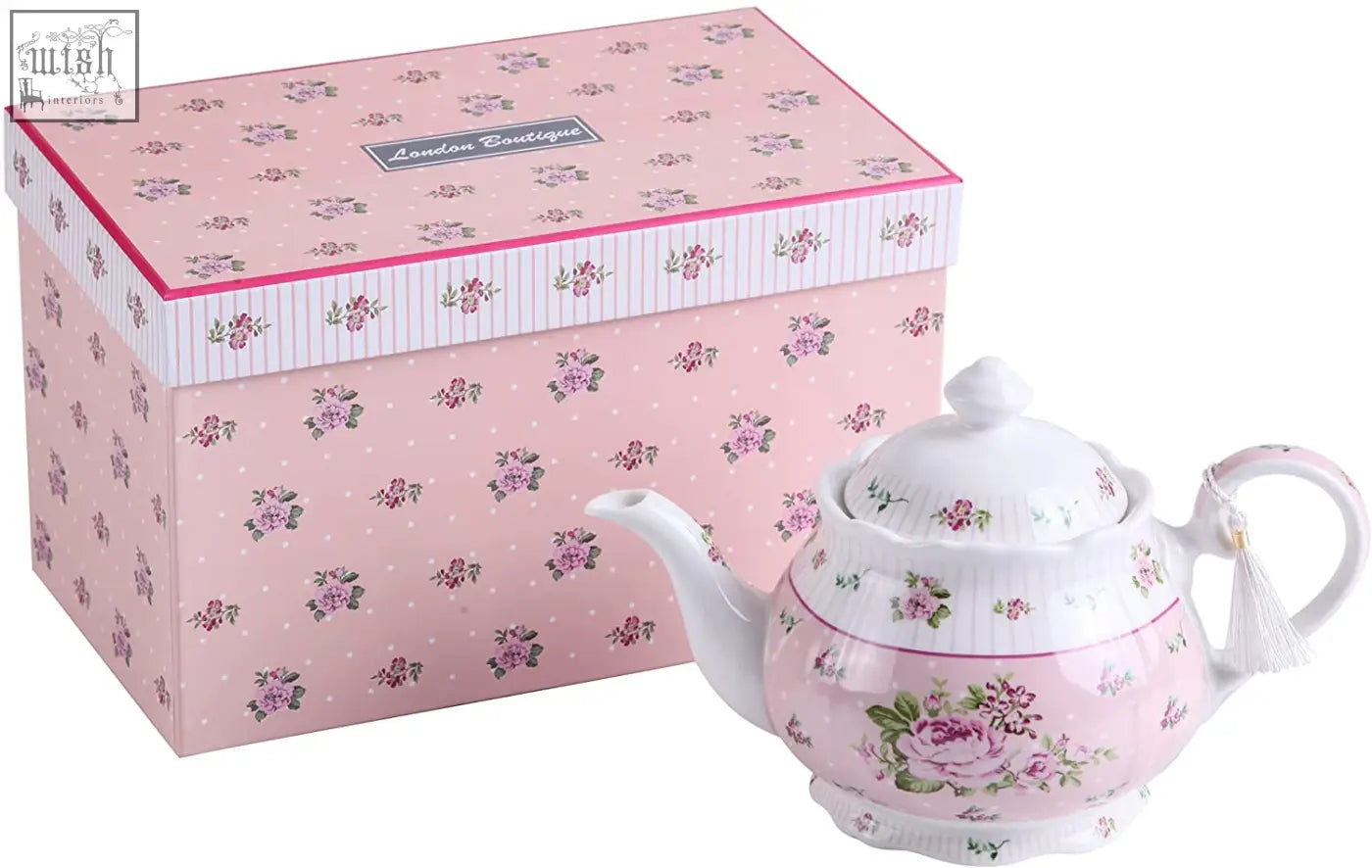 Pink floral porcelain teapot with white lid and handle featuring a delicate rose design in a sugar bowl and milk jug set