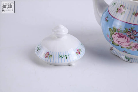 White porcelain teapot lid with pink floral and blue stripes from shabby chic vintage teapot sugar bowl set in gift box