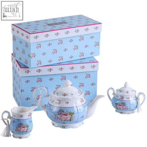 Light blue porcelain teapot sugar bowl and cream jug with pink rose design in matching shabby chic gift box