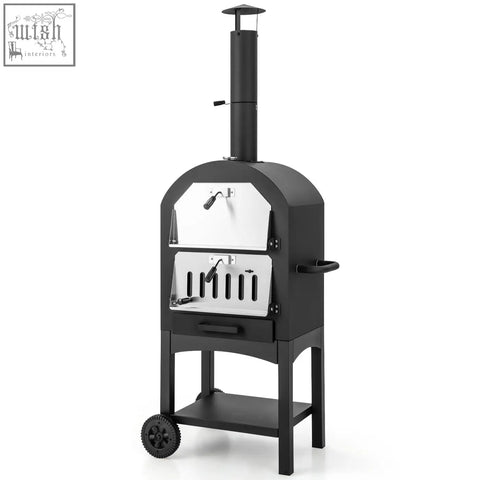 Black cast iron portable pizza oven with stainless steel door and ash drawer on wheeled stand with cooking grids