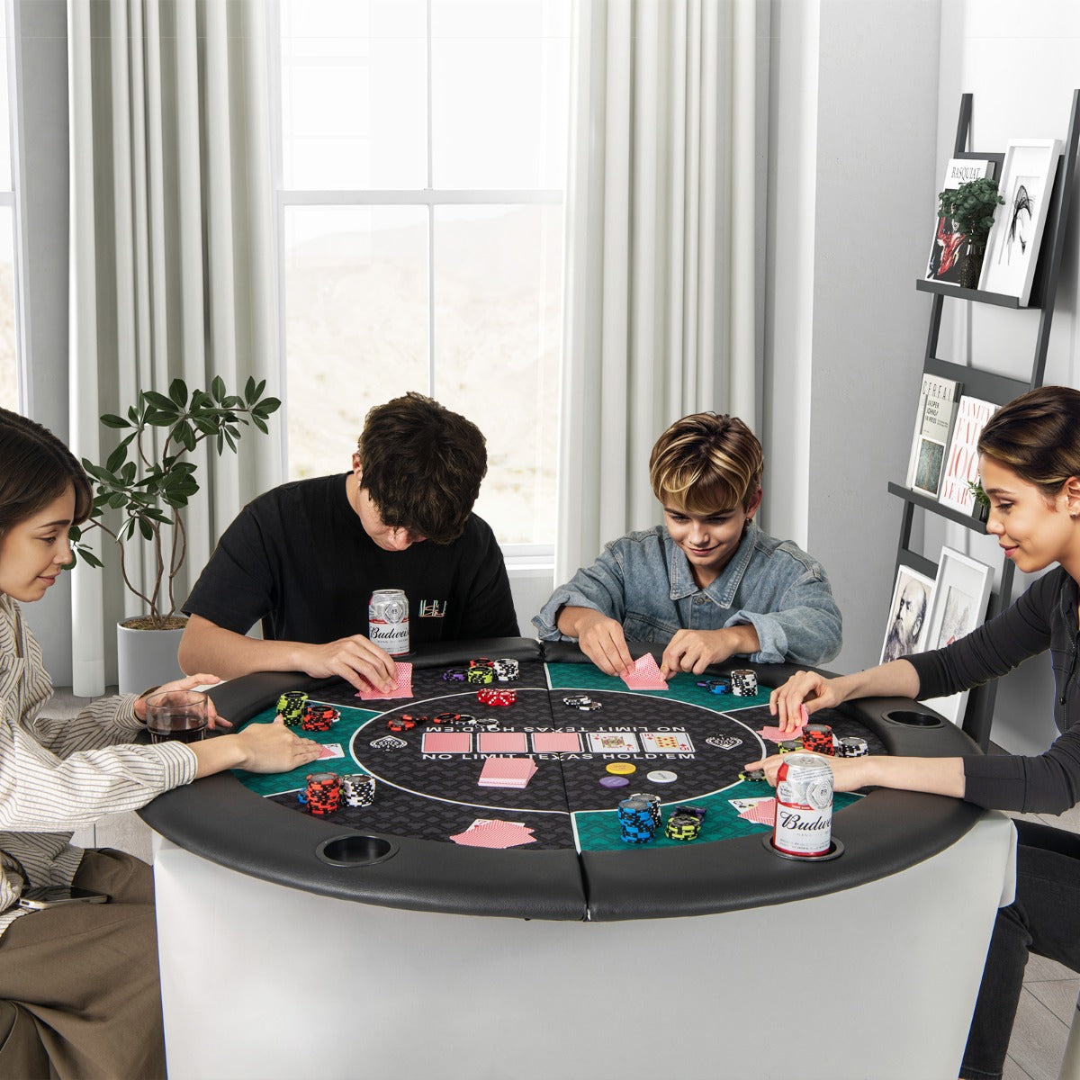 Black and white circular poker table with green felt and cup holders included with carrying bag for easy transport