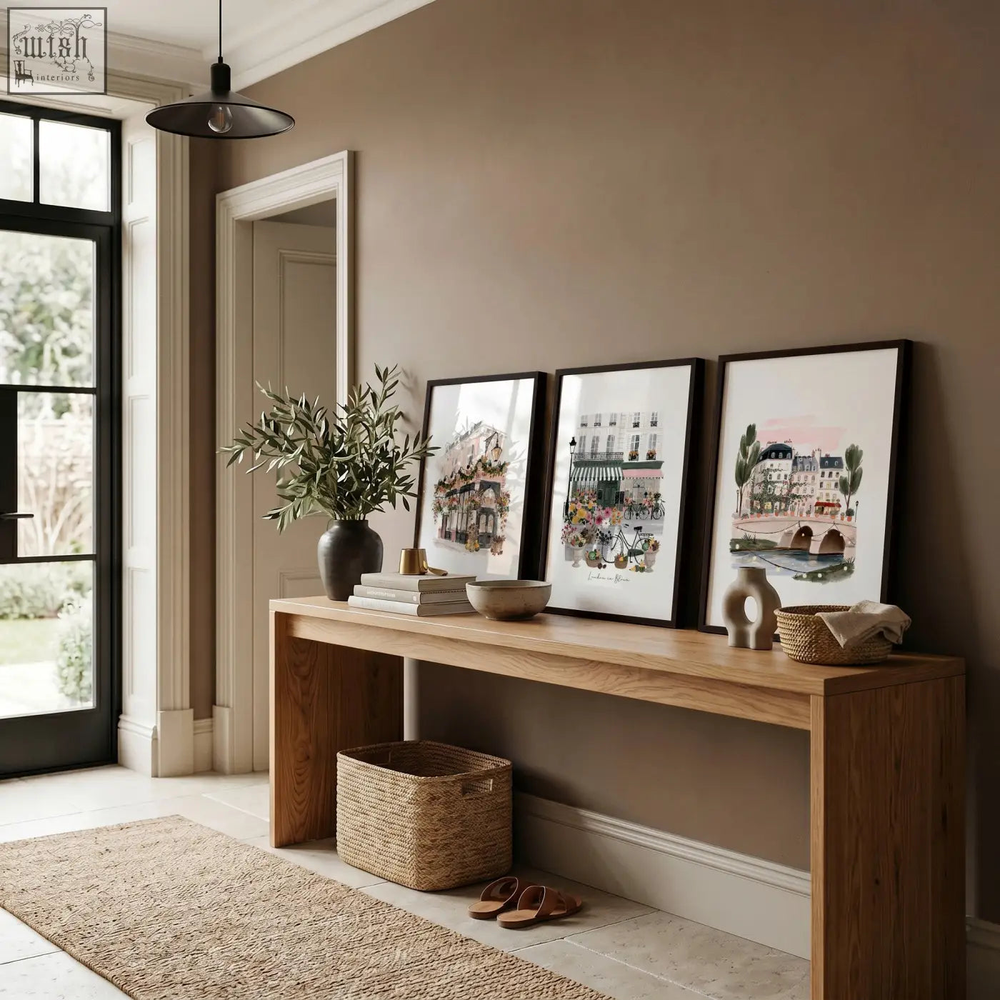 Three framed poster art london floral city scene prints with black frames on a wooden console table