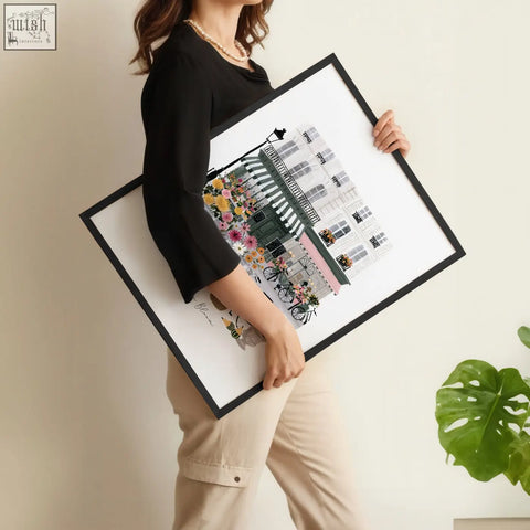 Black-framed poster art london featuring a colorful floral parisian building with bicycles in a set of 3 prints