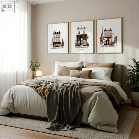 Three framed paris pour toujours street scenes wall art featuring red awnings and eiffel tower motifs above the bed
