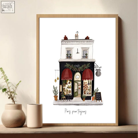 A framed paris street scenes wall art with red awnings and greenery in a light wood frame from the pour toujours set