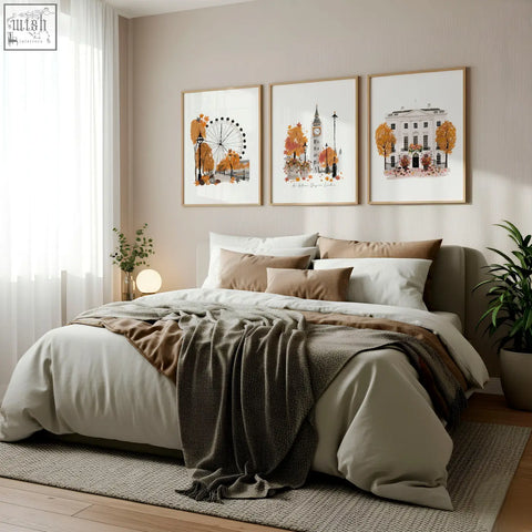 A cozy bed with beige and brown bedding and a dark gray throw in front of big ben london england art prints