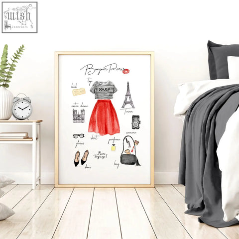 A framed watercolor illustration poster with paris fashion featuring a red skirt striped top and eiffel tower landmarks