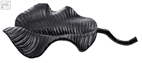 Prato black leaf dish made of cast iron with black finish textured ridged surface and curved stem for serving