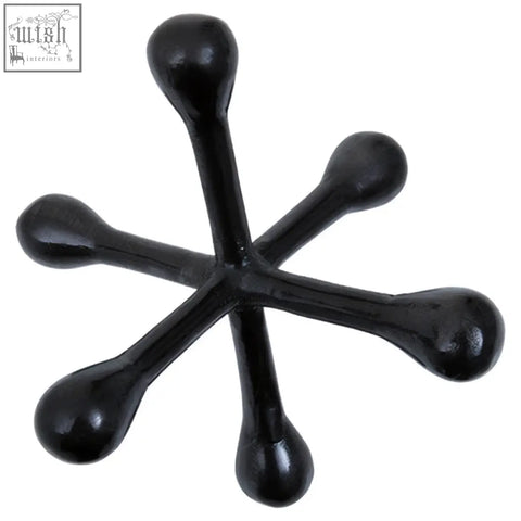 Black glossy plastic jack sculpture with six rounded arms in black nickel finish for stylish decor and massage use