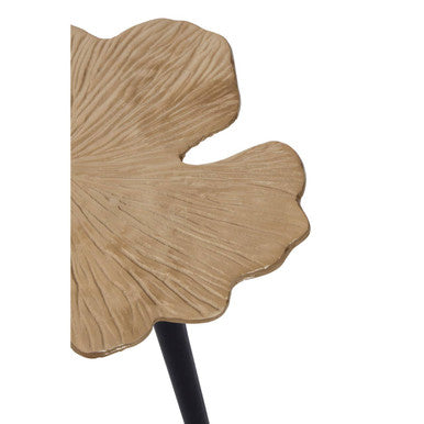 A golden leaf-shaped decorative tray with textured surface and scalloped edges on prato ginkgo small side table