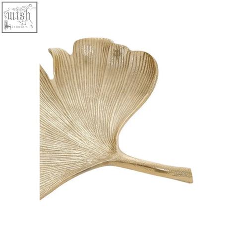 Gold-colored metallic ginkgo leaf decorative tray with detailed vein patterns in antique gold finish