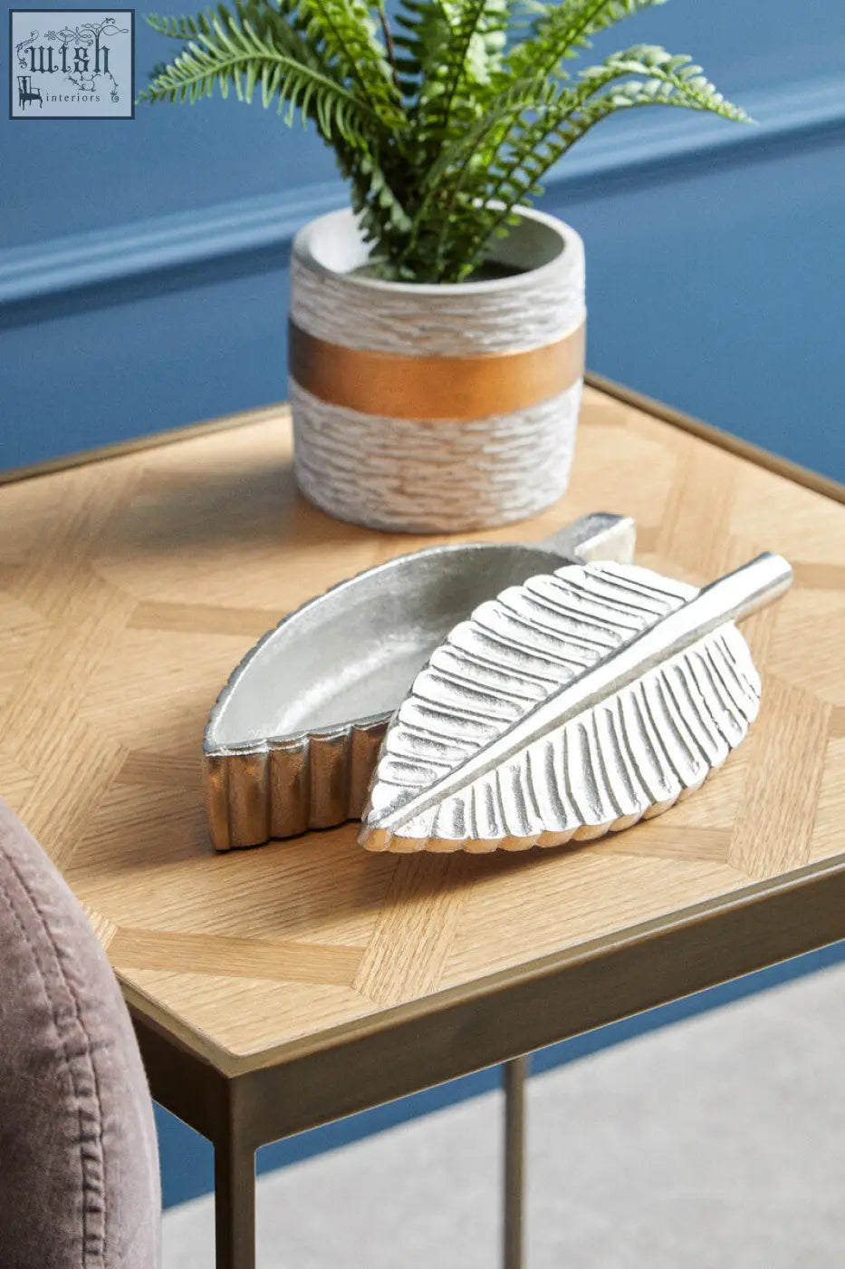 Silver plume box ashtray shaped like a leaf with textured ridges and a matching metallic handle in silver finish