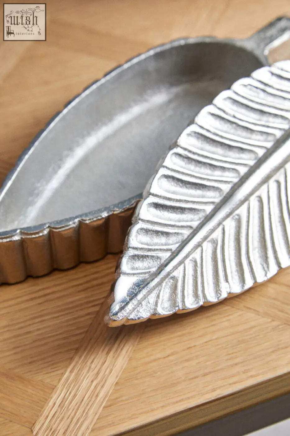 Silver plume box serving dish shaped like a leaf with embossed veins and scalloped edges in silver finish