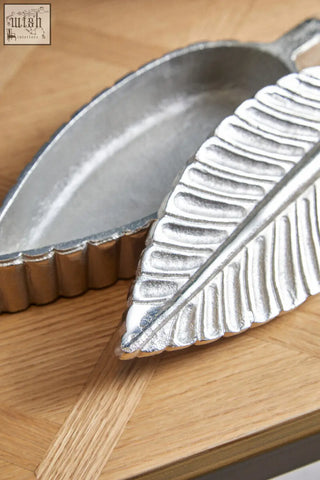 Silver plume box serving dish shaped like a leaf with embossed veins and scalloped edges in silver finish