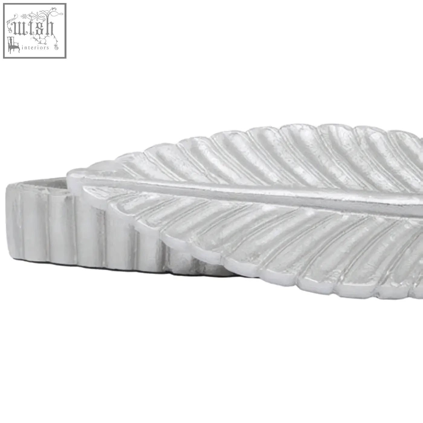 White leaf-shaped footstool with textured silver plume box surface and ridged edges in prato silver finish