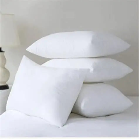 Stack of white premium hypoallergenic microfibre pillows with soft plush fabric and hotel quality support for all sleep positions