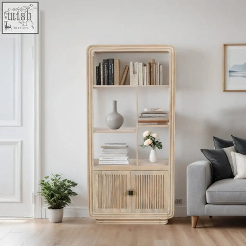 Light wood preston bookcase with modern open shelves and two louvered doors made from sustainably sourced mango wood