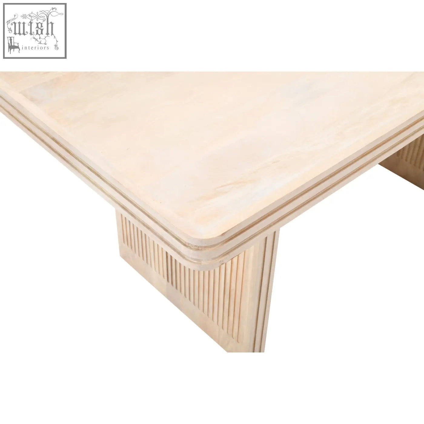 Preston mango wood dining table with light wood, smooth textured surface, and vertical grooves on the legs