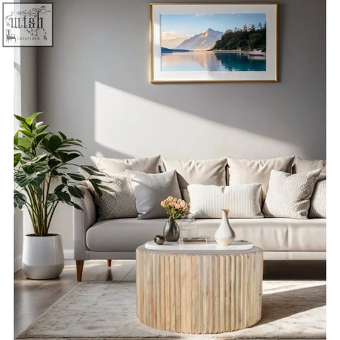 Light beige mango wood round coffee table with vertical slats and a white top perfect for any living room