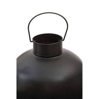 Small antique black metal lantern with matte finish and curved handle perfect for vintage decor
